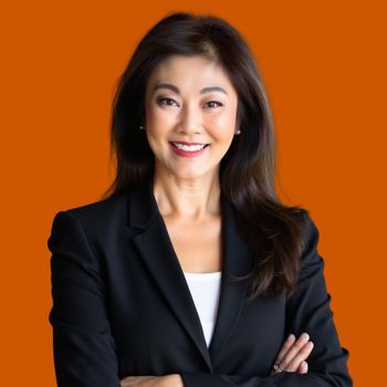 Melinda Corp Head Shot Oct '25 Orange